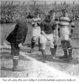 Herb Gilbert observes the tossing of the coin